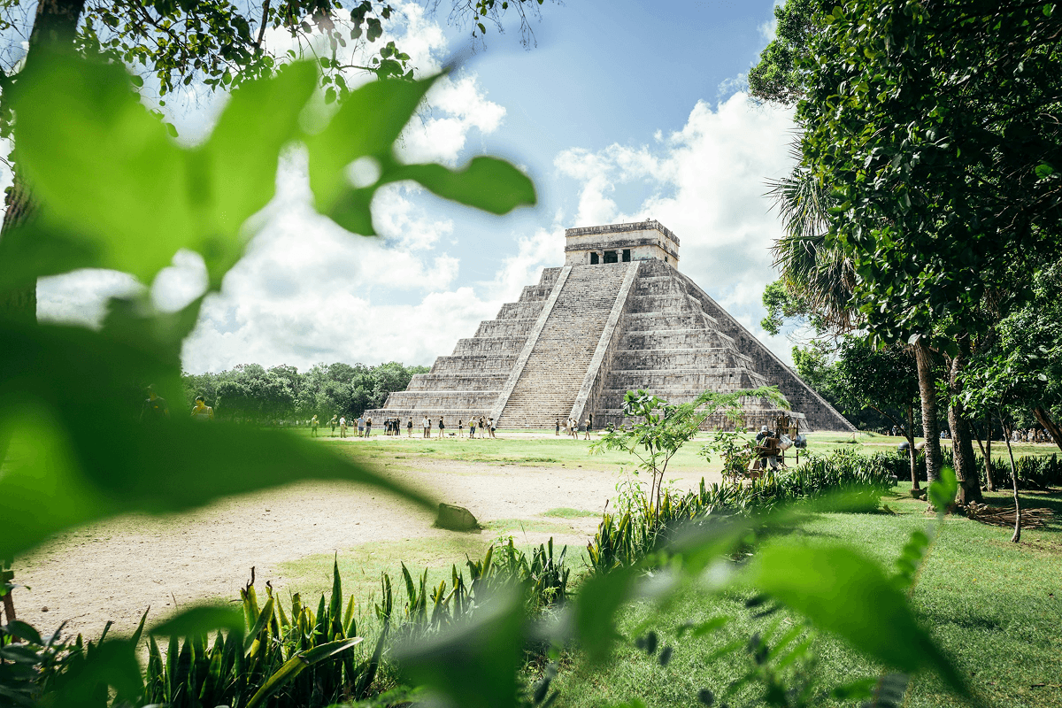 Chichen Itza ruins surrounded by lush greenery